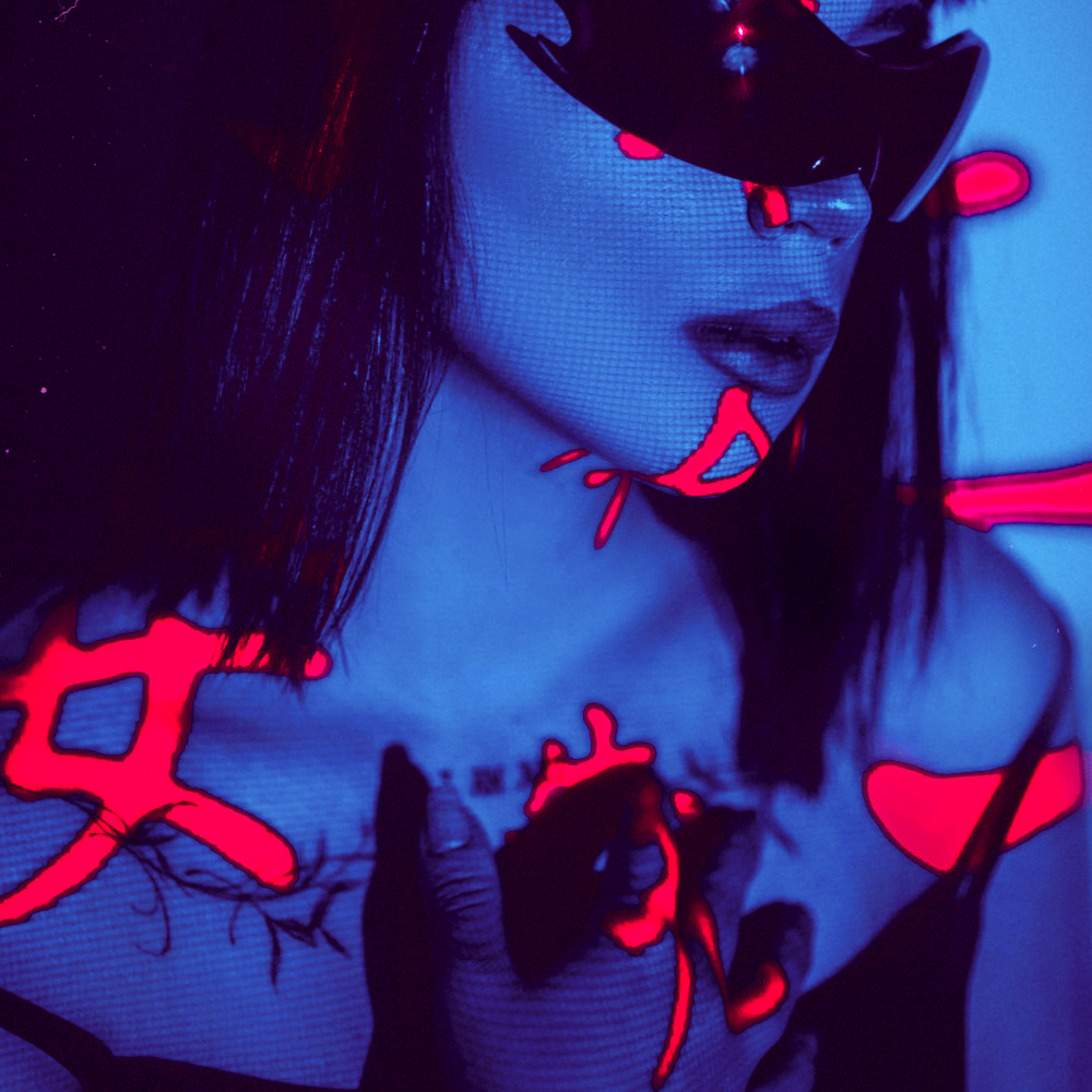 Blue-lit portrait with black visor and red projected shapes.