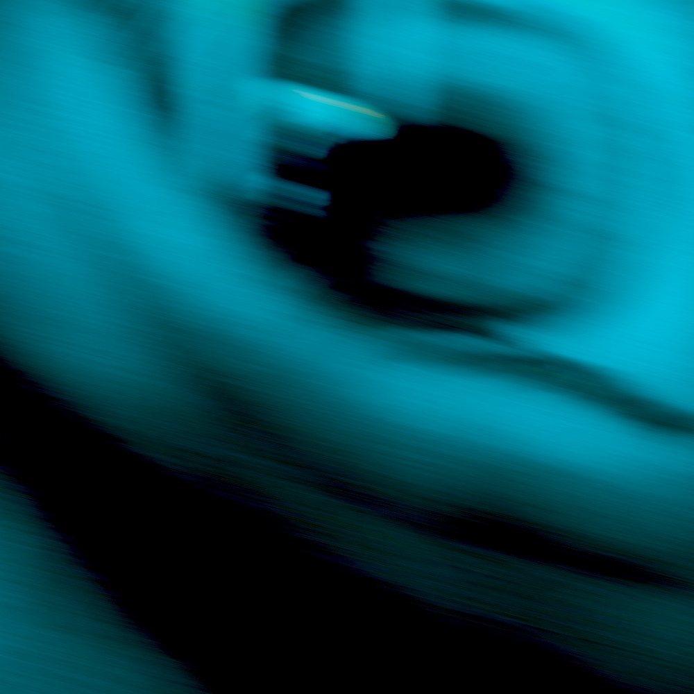 Abstract cyan motion blur with dark silhouette for brand asset curation services and curated visual libraries.